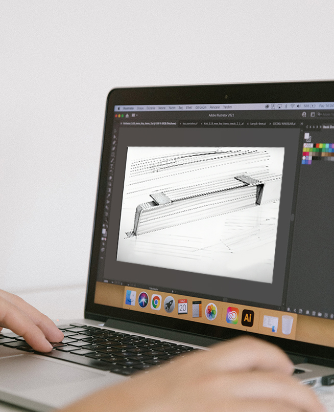 Designing sofa legs using a laptop, showcasing DELTA CAINA's innovative approach to customizable furniture hardware solutions with precision and creativity.
